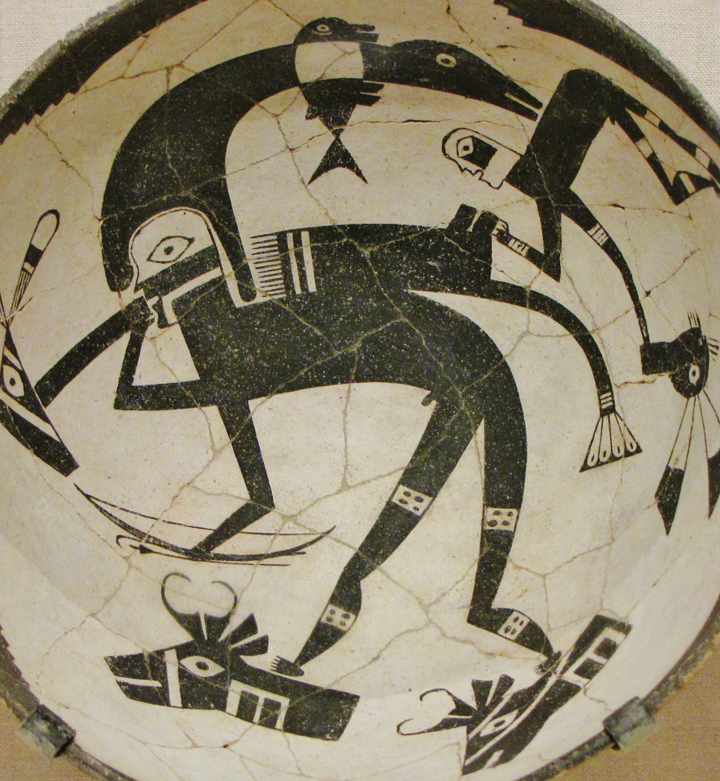 Bowl Depicting a Hero-Hunter with a Heron Headdress, Bow, and Arrows, along with a Rabbit Hunter; ceramic and pigment (Classic Mimbres Black-on-white); Mimbres branch of the Mogollon; New Mexico, United States