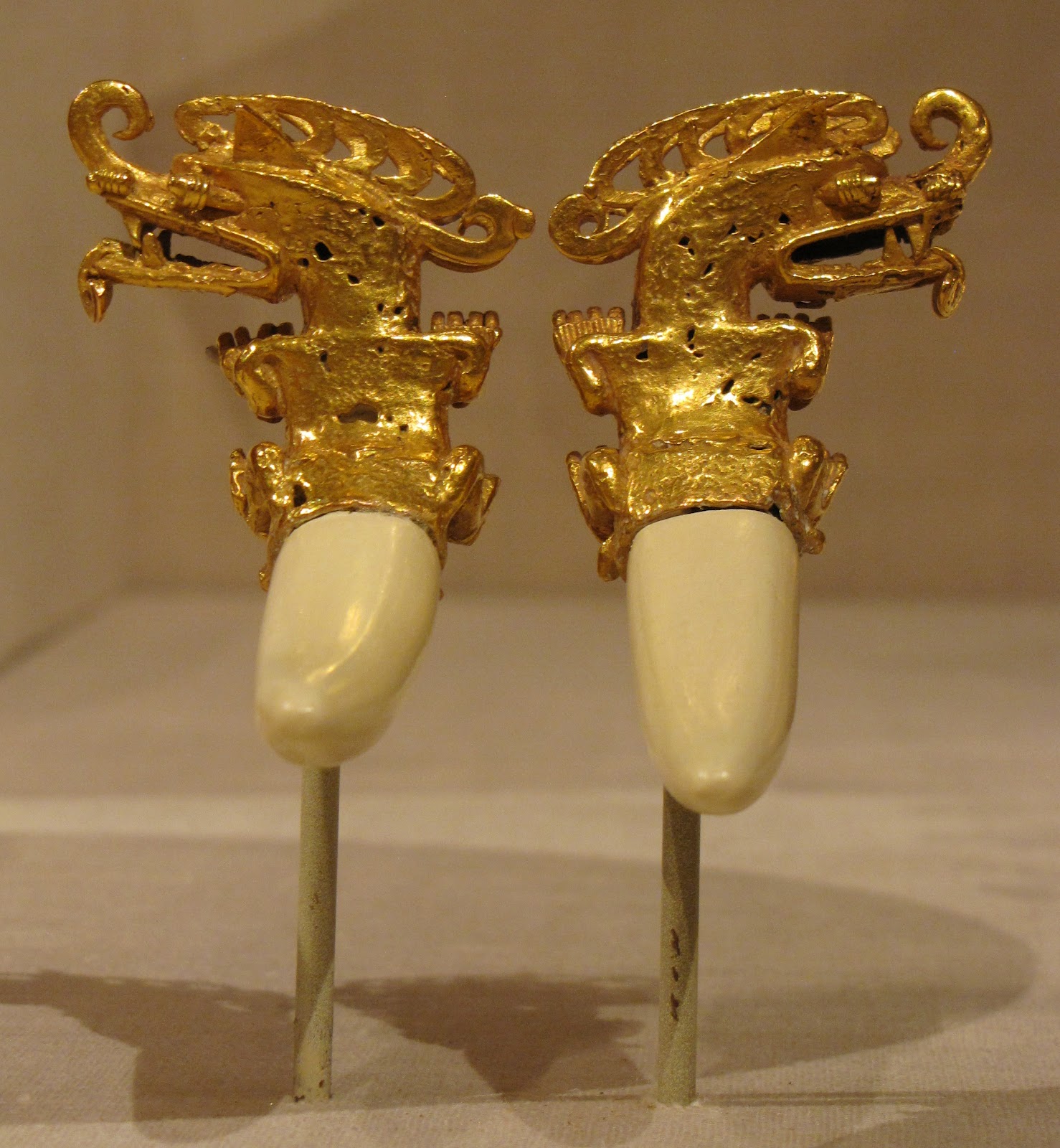 Double Pendant in the Form of a Mythical Caiman, gold with plaster restoration of boar tusks, 800/1200 CE, Coclé; Coclé province, Panama