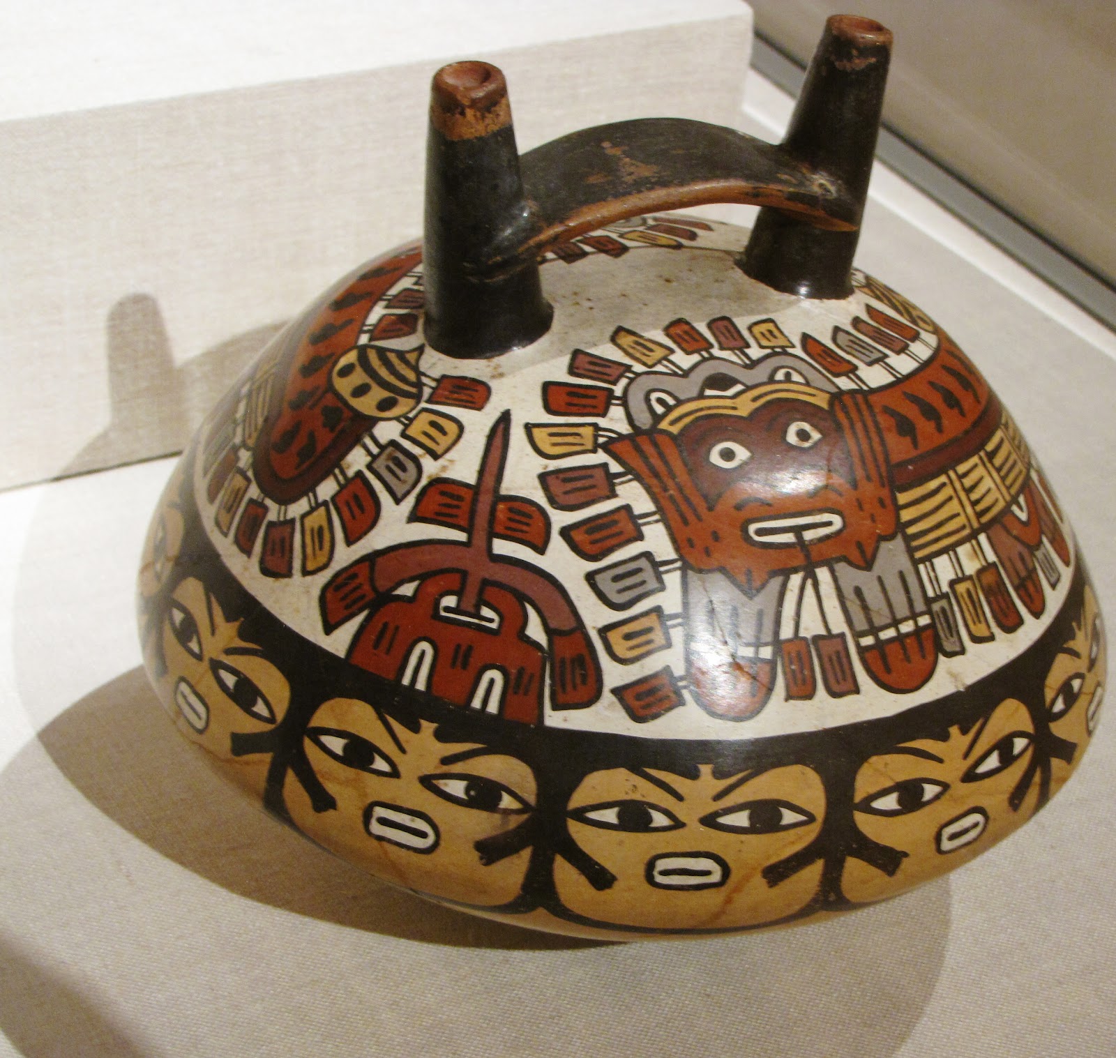 Double-Spouted Vessel Depicting Ritual Masks, ceramic and pigment, 180 BCE/500 CE, Nazca; South coast, Peru